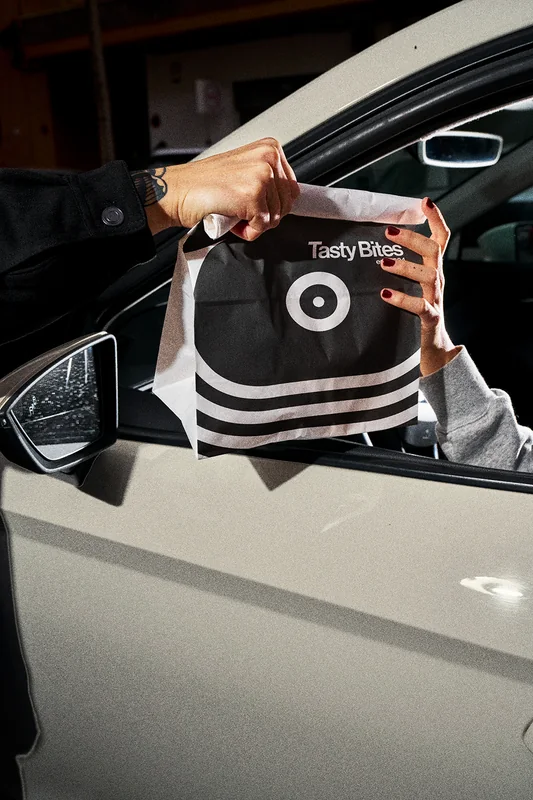 Brand packaging photographed beside a car